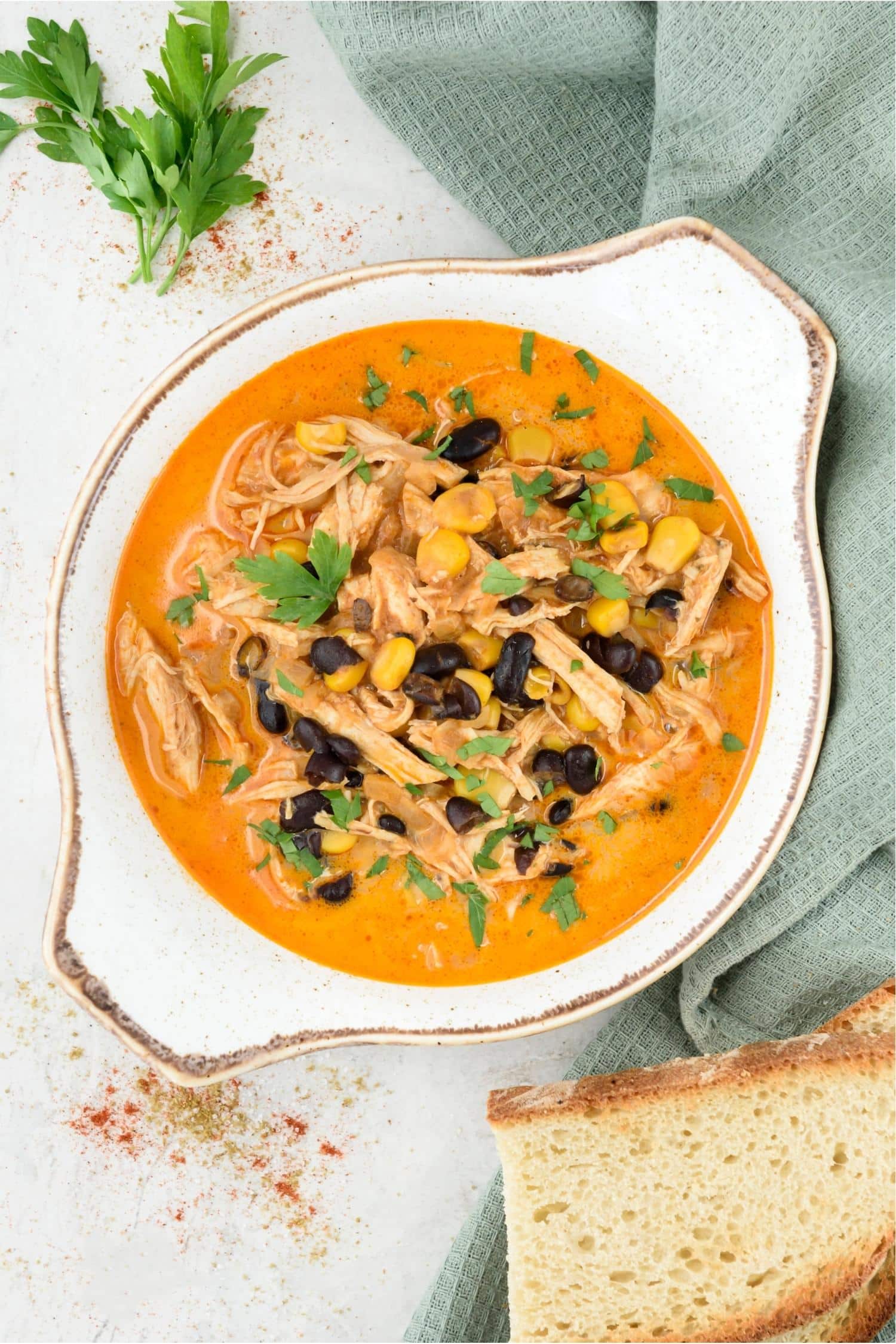 Overhead view of a bowl of chicken enchilada soup.