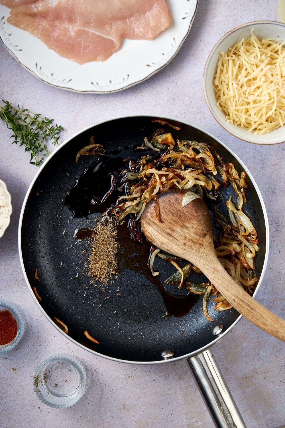 A skillet of caramelized onions with balsamic vinegar, Worcestershire sauce, and thyme.