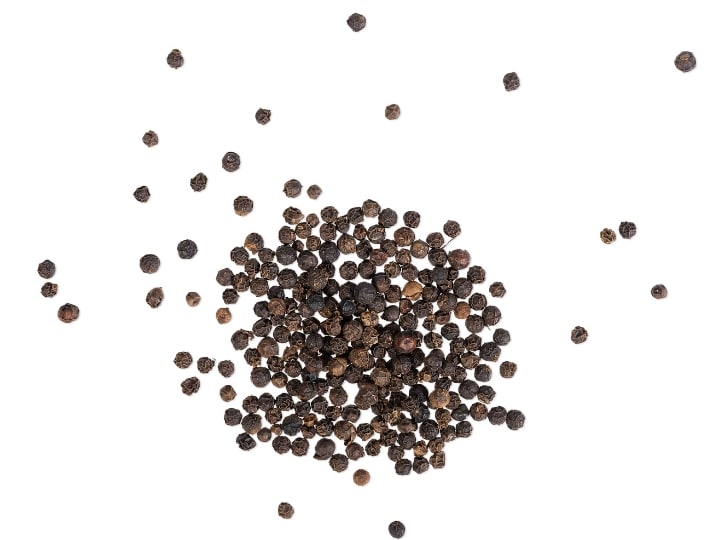 A bunch of black pepper corns.