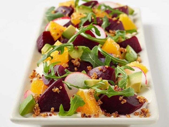 A plate of cheesecake factory Beet and Avocado Salad.