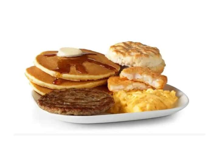 Pancakes, sausate, eggs, hashbrown, and an english muffin.