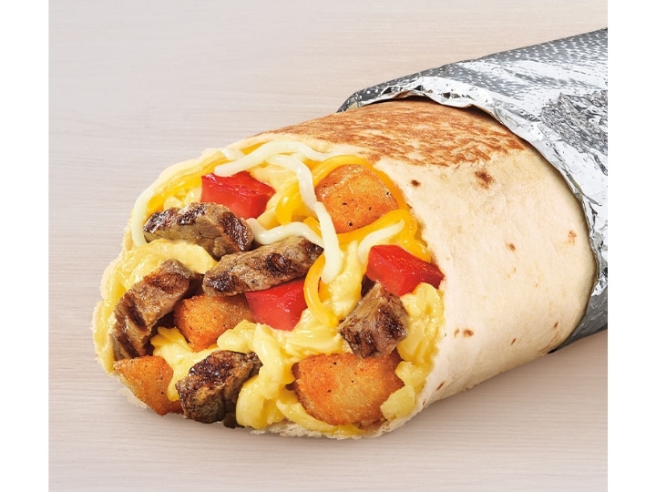 Steak, eggs, cheese, and tater tots in a tortilla.