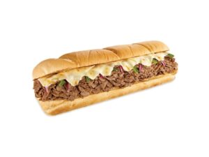 A sub with provolone cheese, peppers, onion, and shaved steak.