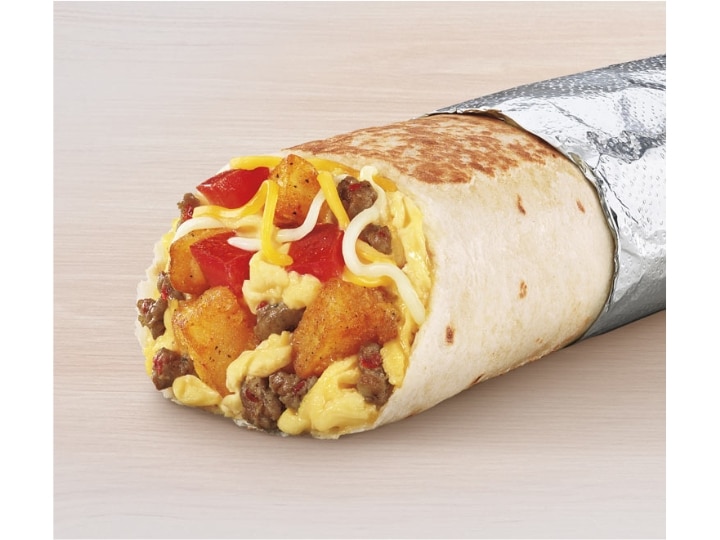 A tortilla filled with sausage, eggs, cheese, and tater tots.