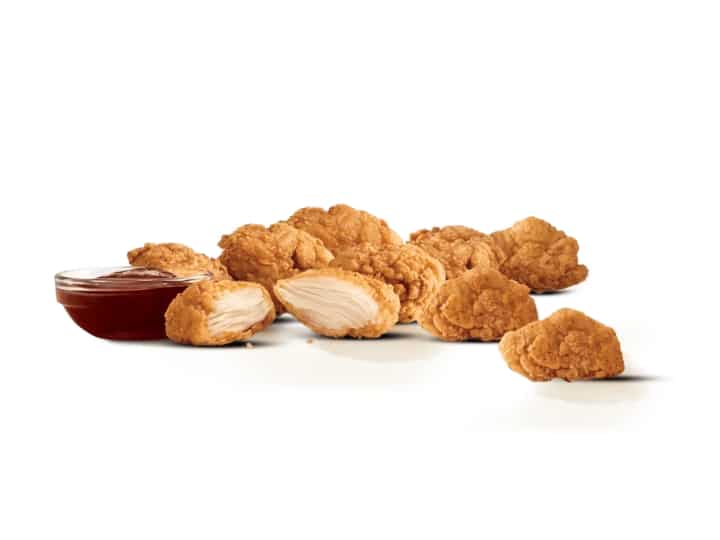 Nine pieces of chicken nuggets and a cup of bbq sauce.