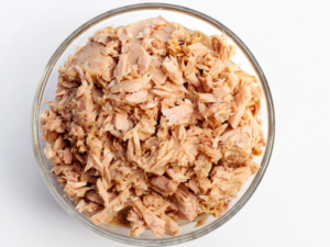 Canned tuna in a glass bowl.