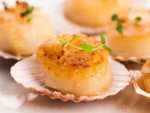 A scallop on a plate.