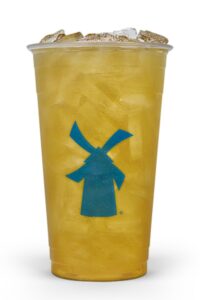 a clear cup of dutch bros passion fruit tea.