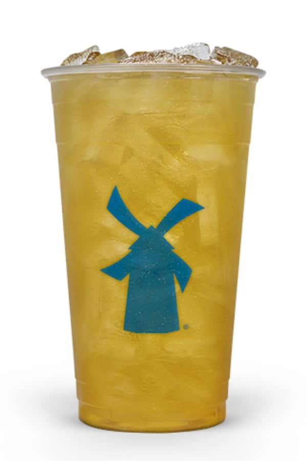 a clear cup of dutch bros passion fruit tea.