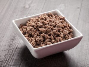 A white bowl of ground beef.