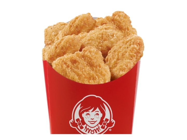 A bunch of chicken nuggets in a Wendy's box.