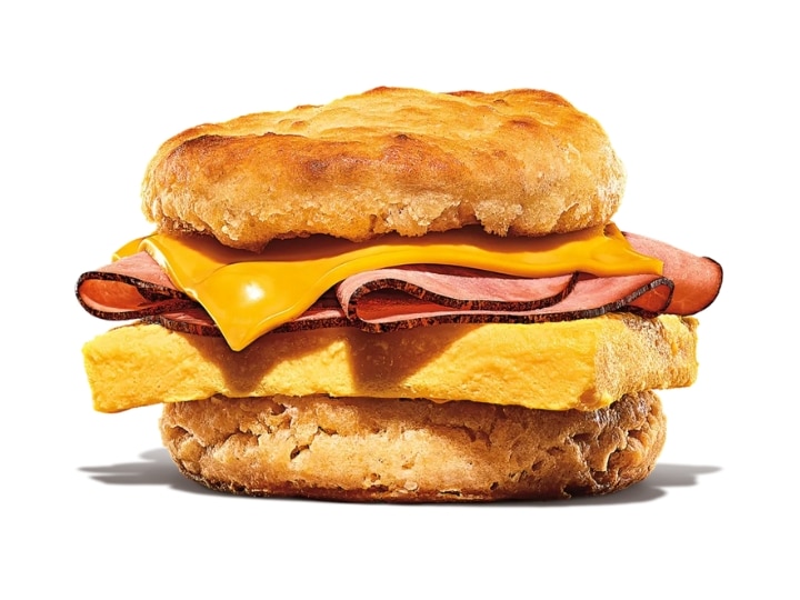 A biscuit with ham, cheese, and an egg.