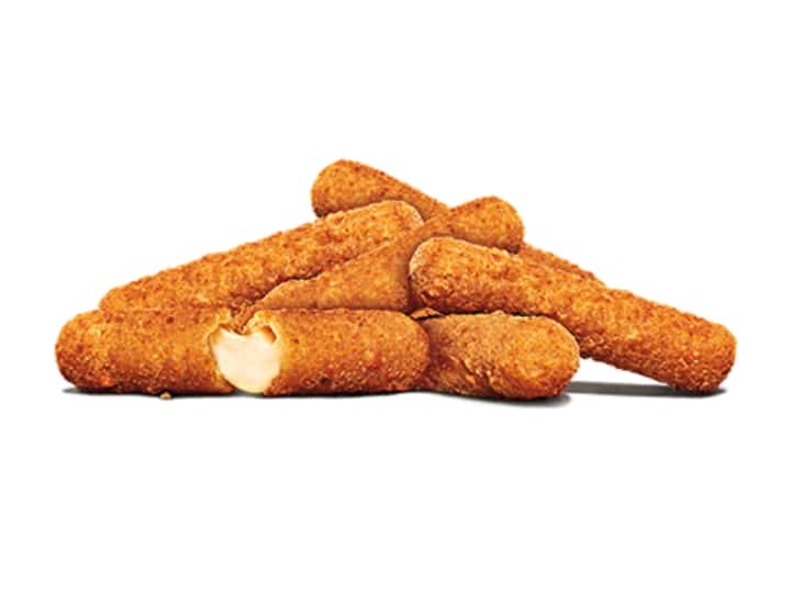 A bunch of mozzarella sticks overlapping one another.
