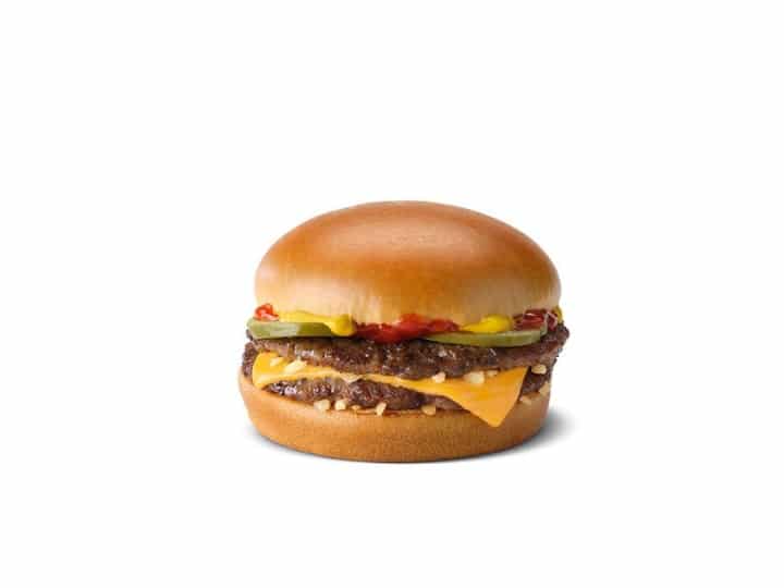 A double cheeseburger with ketchup, pickles, and mustard.