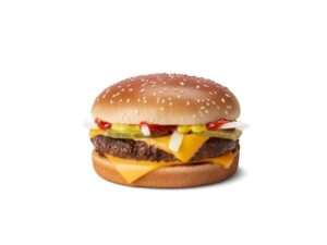 A cheeseburger with ketchup, pickles, and onion.