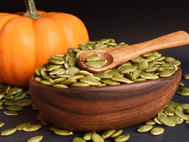 A bowl of pumpkin seeds.