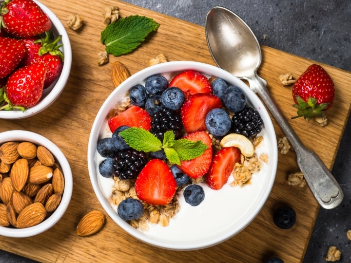 A bowl of fruit and yogurt.