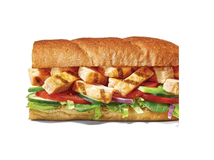 A six inch subway grilled chicken sub with lettuce, tomato, and green peppers.