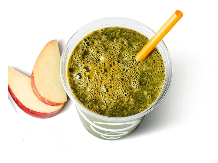 A cup of dark green juice.