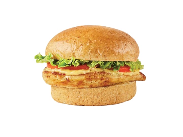 A grilled chicken sandwich with lettuce, tomato, and cheese.