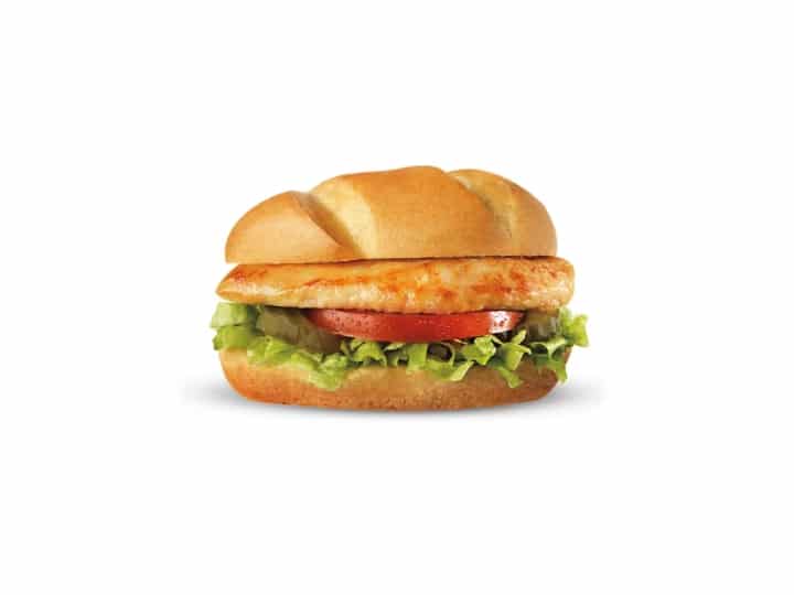 A grilled chicken sandwich with lettuce and tomato.