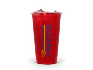 A clear cup of strawberry soda.