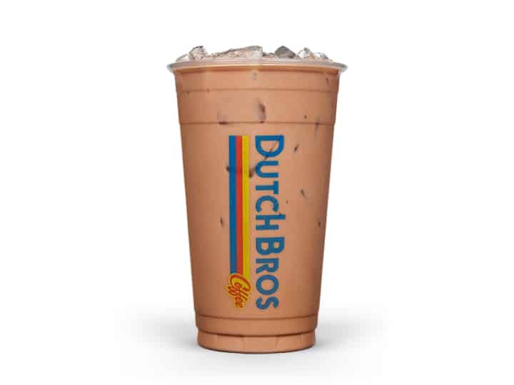 A clear cup of almond milk mocha caramelizer from dutch bros.