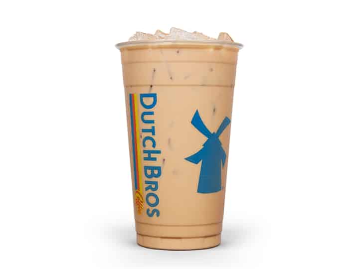 A clear cup of almond milk kicker from dutch bros.