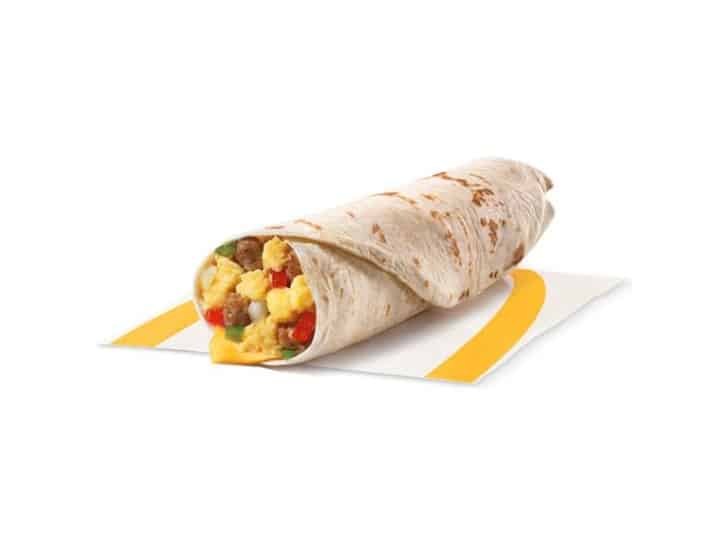 A sausage and egg breakfast burrito with peppers