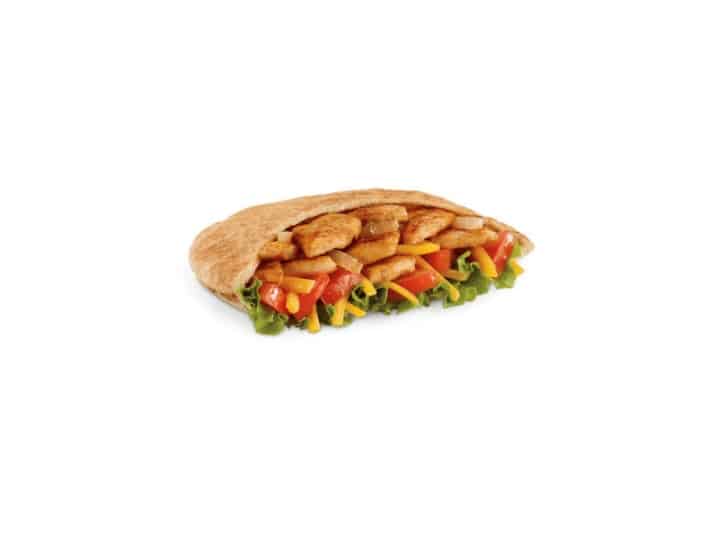 A chicken fajita pita with grilled chicken, lettuce, and tomato.