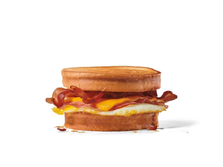 An egg, bacon, and cheese sandwich on sourdough bun.