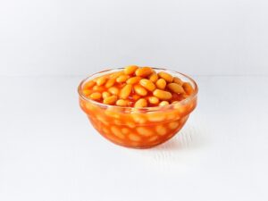 A bowl of baked beans.