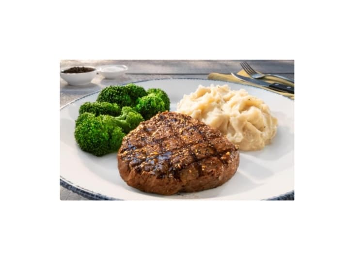 A piece of steak, broccoli, and mashed potatoes on a plate.