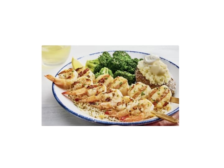 Red Lobster sea scallops and shrimp skewers on a plate.