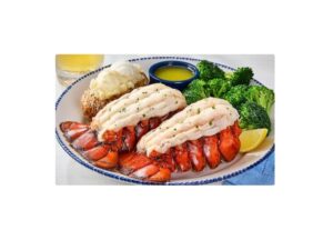 Two pieces of Red Lobster main tails on a plate.