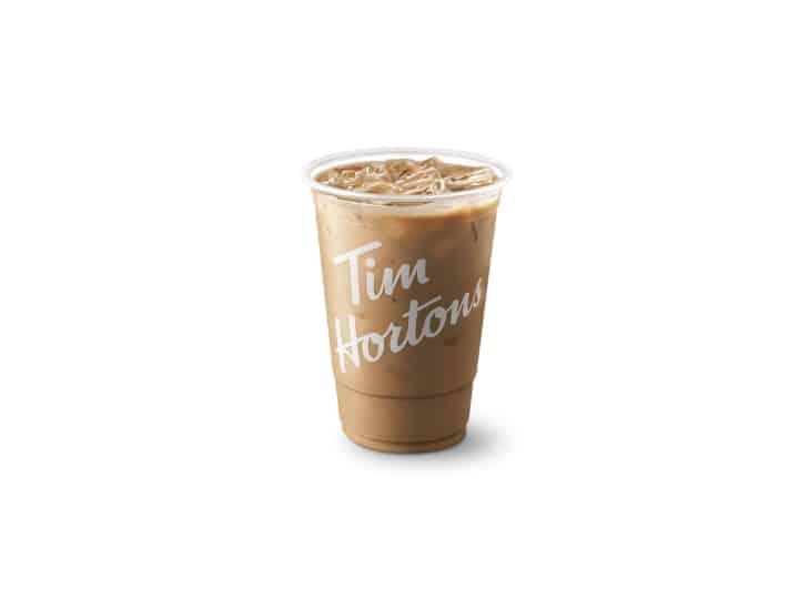 A iced coffee with cream and sugar in a tim hortons cup.