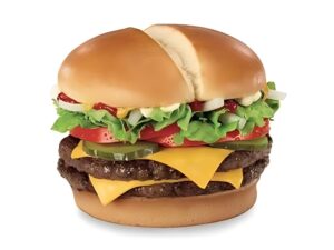 A double cheeseburger with lettuce, tomato, pickles, and sauce.