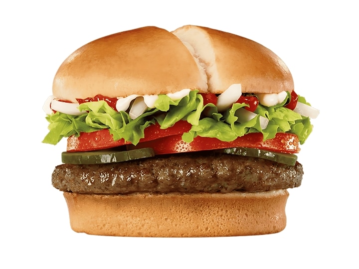 A cheeseburger with lettuce, tomato, pickles, and sauce.