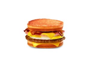 A breakfast sandwich with egg, cheese, and bacon.