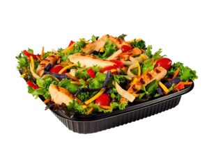 A southwest chicken salad in a black container.