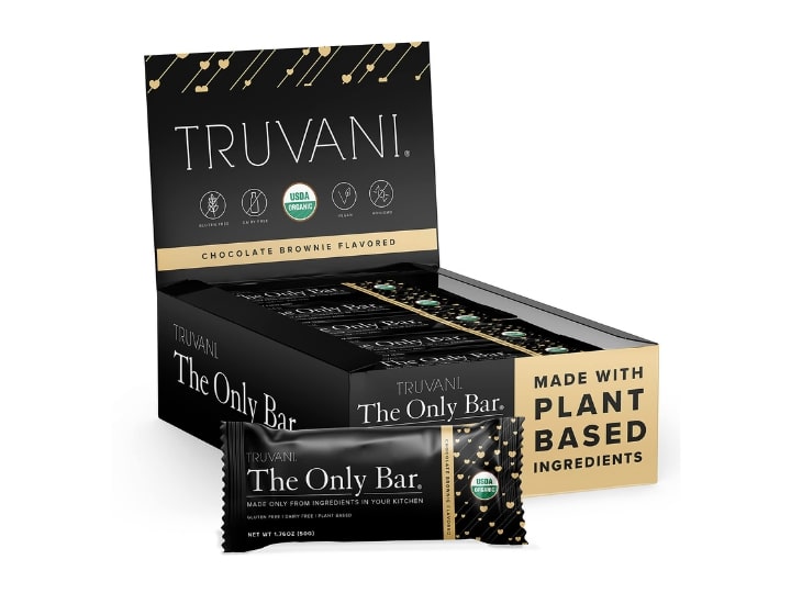 A box of Tuvani Only Bar protein bars inside of their packaging.