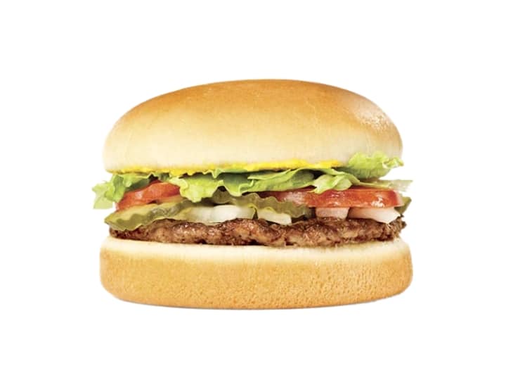 A burger with lettuce, pickles, tomato, and onion.