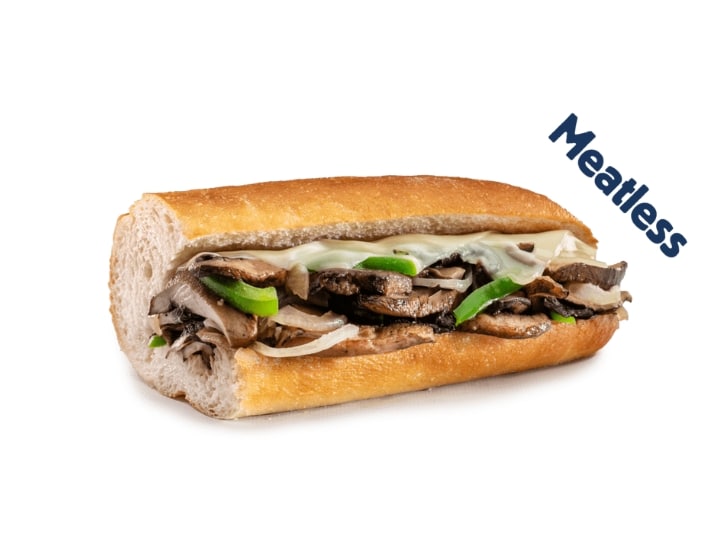 Half a sub with protabell mushrooms, green peppers, onion, and cheese.