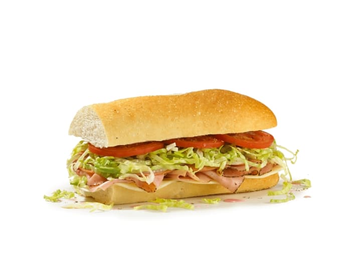 Half a sub with Provolone, ham, prosciuttini and cappacuolo, lettuce, and tomato.