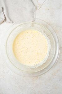 Overhead view of a white creamy mixture.