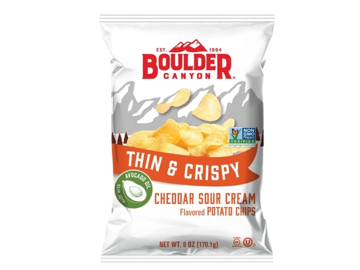 A image of a bag of Boulder Canyon cheddar sour cream flavored potato chips on a white background