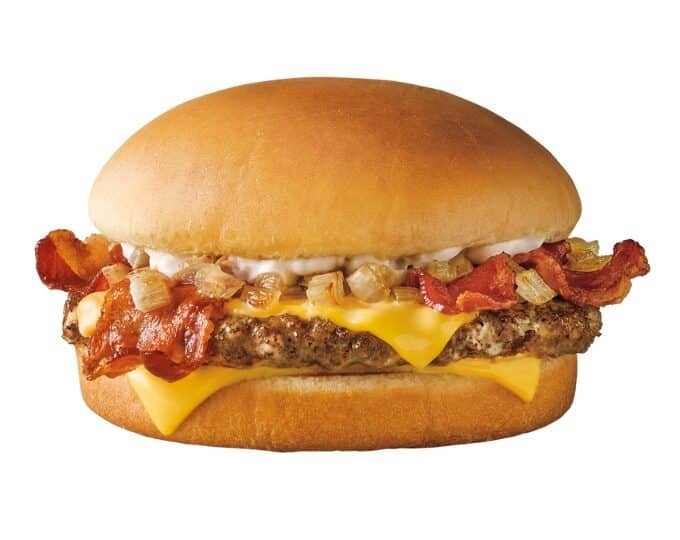 A garlic butter bacon cheeseburger on a white background.