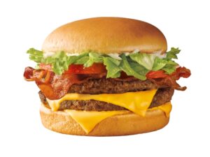 A double cheeseburger with bacon on a white background.