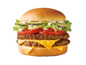 A double cheese burger with pickles on a white background.