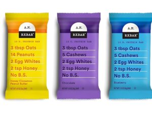 Three wrapped RX AM bars. The flavors are Honey Cinnamon Peanut Butter, Chocolate, and Blueberry all on a white background